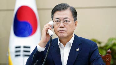This handout photo taken on September 24, 2020 and released by the presidential Blue House shows South Korean President Moon Jae-in talking on the phone with Japanese Prime Minister Yoshihide Suga at his office in Seoul. Japan's new Prime Minister Yoshihide Suga on September 24 called for better ties with South Korea in talks with President Moon Jae-in, the first in months between leaders of the countries.