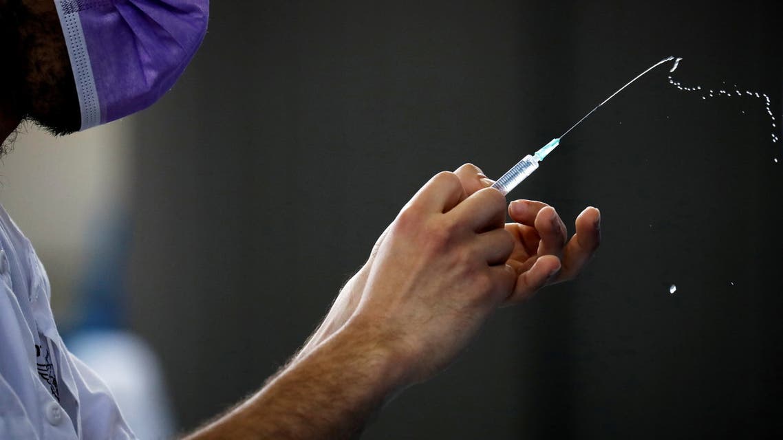 A medical worker prepares to administer a vaccination against the coronavirus disease (COVID-19) at a temporary Clalit healthcare maintenance organisation (HMO) centre, at a sports hall in Netivot, Israel February 4, 2021. (File Photo: Reuters)