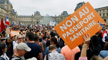 Demonstrators attend a protest against the new measures announced by French President Emmanuel Macron to fight the coronavirus disease (COVID-19) outbreak, in Paris, France, July 17, 2021. (Reuters)