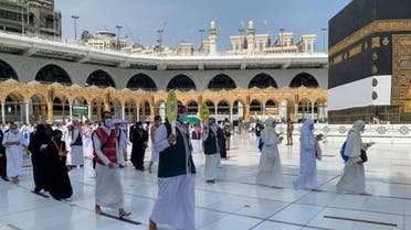 A guide leads Muslims as they begin the Hajj ritual on July 17, 2021 amid the coronavirus pandemic in Mecca, Saudi Arabia. (Twitter)