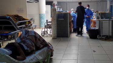 Patients suffering from the coronavirus disease (COVID-19) receive treatment at the emergency department of Charles Nicole Hospital in Tunis, Tunisia July 13, 2021. (Reuters)