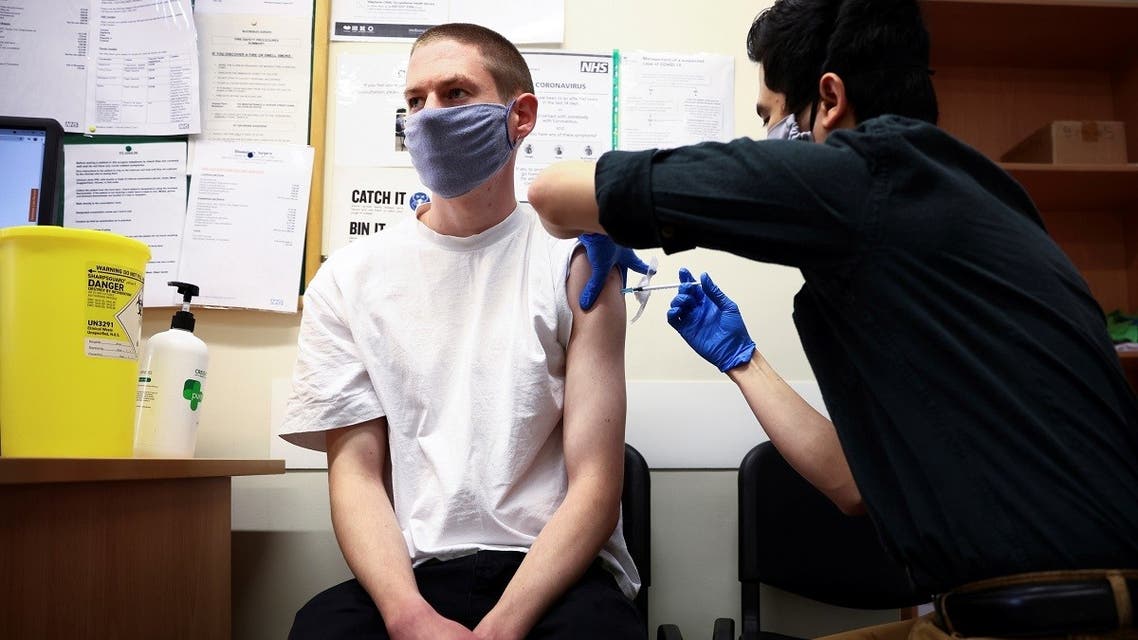 A person receives a dose of the Pfizer BioNTech vaccine, at vaccination centre for young people and students at the Hunter Street Health Centre, amid the coronavirus disease (COVID-19) outbreak, in London. (Reuters)