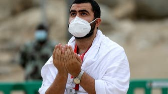 Masked Hajj pilgrims on Mount Arafat pray for COVID-19-free world
