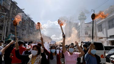 A group of women hold torches as they protest against the military coup in Yangon, Myanmar July 14, 2021. (File photo: Reuters)