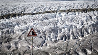 This picture taken on October 01, 2019 shows a warning sign for rockslide next to the Aletsch glacier above Bettmeralp, Swiss Alps.The mighty Aletsch – the largest glacier in the Alps – could completely disappear by the end of this century if nothing is done to rein in climate change, a study showed on September 12, 2019 by ETH technical university in Zurich. (Fabrice Coffrini/AFP)