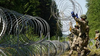Belarusian guards cross into Lithuania with dozens of migrants