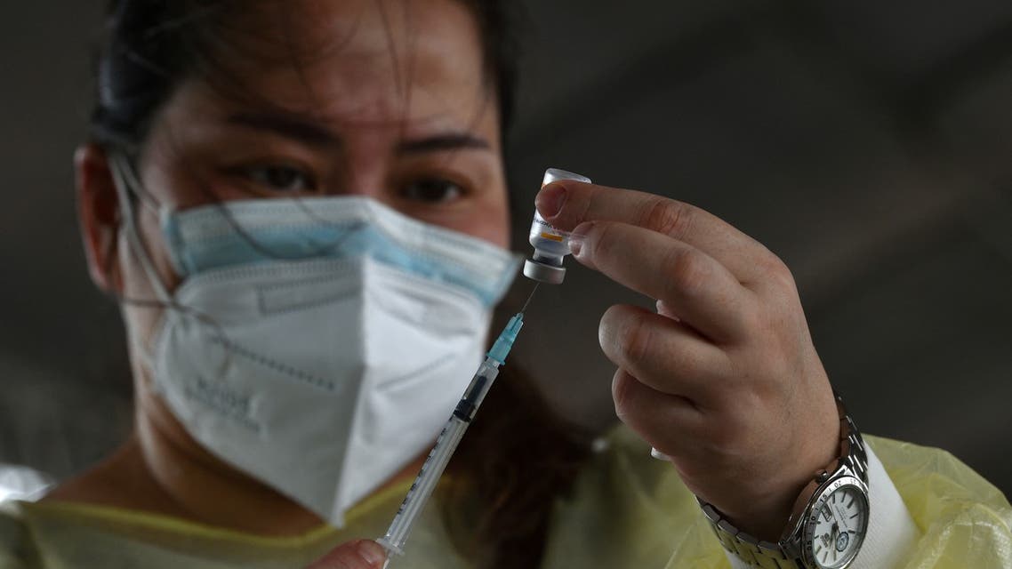 A volunteer medical worker prepares to administer the Sinovac Covid-19 vaccine to tricycle drivers during a vaccination drive for economic frontliners, organised by the vice president's office and city government, in Manila on July 20, 2021.