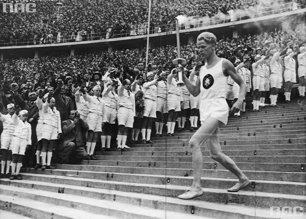 Fritz Schelgen transporting the Olympic flame to the Olympic stadium in Berlin