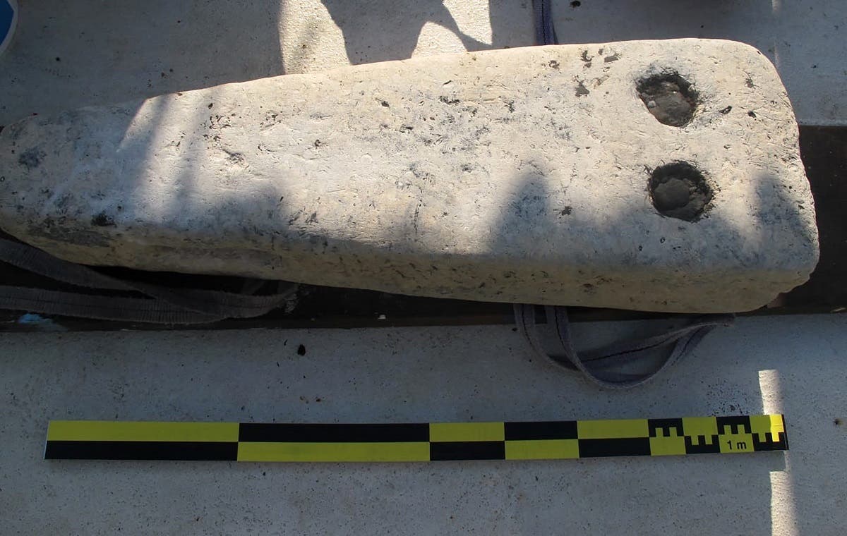 A handout picture released by the Egyptian Ministry of Tourism and Antiquities on July 19, 2021 shows a stone block uncovered in the sunken city of Thonis-Heracleion in Abu Qir bay, on Egypt’s northern Mediterranean coast. (Egyptian Ministry of Antiquities/AFP)