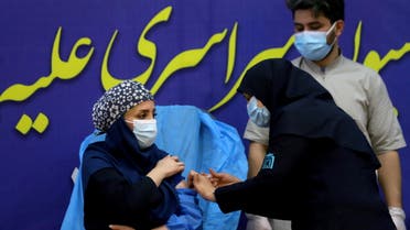 A member of the Imam Khomeini Hospital medical personnel receives a dose of Russia’s Sputnik V vaccine against the coronavirus disease (COVID-19), in Tehran, Iran February 9, 2021. Majid Asgaripour/WANA (West Asia News Agency) via REUTERS ATTENTION EDITORS - THIS IMAGE HAS BEEN SUPPLIED BY A THIRD PARTY.