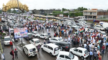 Supporters of newly appointed Punjab Congress party president Navjot Singh Sidhu (not pictured) wait to welcome him at the Golden Gate on the outskirts of Amritsar on July 20, 2021. (AFP)