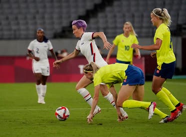 United States forward Megan Rapinoe (15) chases the ball against Sweden during the second half in Group G play during the Tokyo 2020 Olympic Summer Games at Tokyo Stadium. (Reuters)
