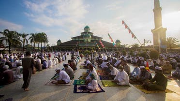 Indonesian Muslims offer Eid al-Adha prayers at a mosque amid a surge of coronavirus disease (COVID-19) cases in Banjarmasin, South Kalimantan province, Indonesia . (Reuters)