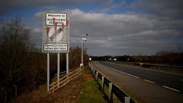 A defaced 'Welcome to Northern Ireland' sign is seen on the Ireland and Northern Ireland border reminding motorists that the speed limits will change from kilometres per hour to miles per hour on the border in Carrickcarnan, Ireland, March 6, 2021. Picture taken March 6, 2021. REUTERS/Clodagh Kilcoyne