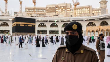 A Saudi police female officer stands guard as pilgrims perform final Tawaf during the annual Haj pilgrimage, in the holy city of Mecca, Saudi Arabia July 20, 2021. REUTERS/Ahmed Yosri
