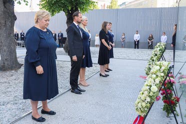 Norway’s PM Erna Solberg, Crown Prince Haakon, Crown Princess Mette-Marit, Workers’ Youth League (AUF) leader Astrid Hoem, and a support group leader Lisbeth Kristine Roeyneland attend a memorial service in the Government Quarter 10 years after the Oslo and Utoeya island bomb attack, in Oslo, Norway, on July 22, 2021. (Reuters)