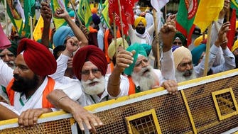 Angry Indian farmers gather near parliament seeking repeal of laws
