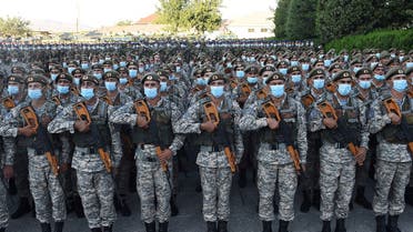 Tajik service members line up during a parade following a nationwide military exercise, in Dushanbe, Tajikistan, on July 22, 2021. (Reuters)