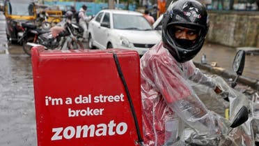 A delivery worker of Zomato, an Indian food-delivery startup, prepares to leave to pick up an order from a restaurant in Mumbai, India, July 13, 2021. (Reuters)