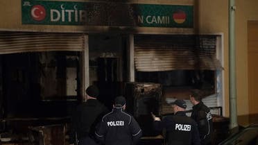In this March 11, 2018 file photo, police stand in front of a mosque that was attacked overnight in Berlin. (AP)