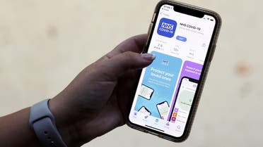 The coronavirus disease (COVID-19) contact tracing smartphone app of Britain's National Health Service (NHS) is displayed on an iPhone in this illustration photograph taken in Keele, Britain, September 24, 2020. REUTERS/Carl Recine/Illustration/File Photo