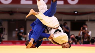  Lukhumi Chkhvimiani of Georgia in action against Naohisa Takato of Japan during the Judo Men’s 60 kg quarterfinal at Nippon Budokan, Japan, July 24, 2021. (Reuters/Sergio Perez)