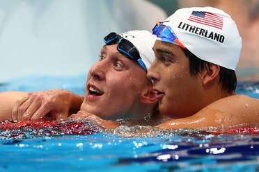 Chase Kalisz of the United States celebrates after winning the gold medal with Jay Litherland of the United States. (Reuters)