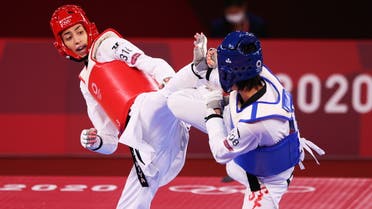Kimia Alizadeh of the Refugee Olympic Team in action against Zhou Lijun of China. (Reuters)