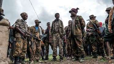 Members of the Amhara militia gather in the village of Adi Arkay, 180 kilometers northeast from the city of Gondar, Ethiopia, on July 14, 2021. On Wednesday the Amhara government spokesman Gizachew Muluneh announced that regional special forces and militias would shift to attack mode to reverse the recent battlefield gains by the Tigrayan rebels.