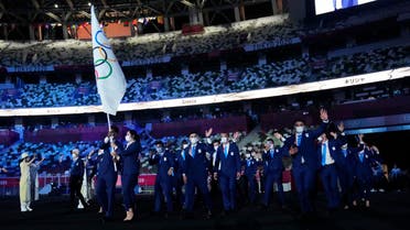 The Refugee Olympic Team enters the stadium during the opening ceremony for the Tokyo 2020 Olympic Summer Games on July 23 2021. (USA Today/Reuters)