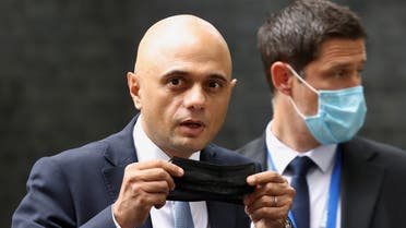 FILE PHOTO: Britain's new Health Secretary Sajid Javid holds a face mask, as he leaves the Downing Street in London, Britain, June 30, 2021. REUTERS/Henry Nicholls/File Photo
