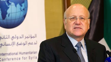 Lebanon's caretaker Prime Minister Najib Mikati attends a news conference at the opening session of the Syrian Donors Conference at Bayan Palace Liberation Hall in Kuwait City January 15, 2014. Western and Gulf Arab nations pledged $1.4 billion on Wednesday for United Nations aid efforts in Syria, where an almost three-year-old civil war has left millions of people hungry, ailing or displaced. REUTERS/Stephanie McGehee (KUWAIT - Tags: POLITICS)