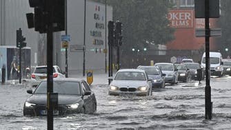 Buses and cars stranded on London roads as storm floods capital