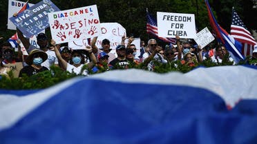 People gather for a Cuba protest as people wave signs and wear Cuban flags in Lafayette Square near the White House in Washington DC, US, on July 26, 2021. (Brendan Smialowski/AFP)