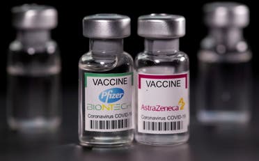 Vials with Pfizer-BioNTech and AstraZeneca coronavirus disease (COVID-19) vaccine labels are seen in this illustration picture taken March 19, 2021. (File phot: Reuters)