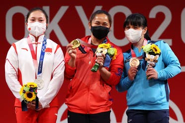 Tokyo 2020 Olympics - Weightlifting - Women's 55kg - Medal Ceremony - Tokyo International Forum, Tokyo, Japan - July 26, 2021. Gold medalist Hidilyn Diaz of the Philippines, silver medalist Liao Qiuyun of China and bronze medalist Zulfiya Chinshanlo of Kazakhstan pose. (Reuters)
