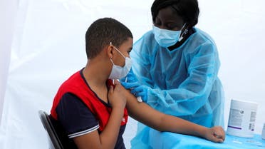 12-year-old Justing Concepcion receives a dose of the Pfizer-BioNTech vaccine in New York City, June 4, 2021. (Reuters)