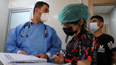 Iraqi medics provide treatment to Coronavirus patients at a hospital in the northern Iraqi city of Dohuk, about 260 miles (430 kilometers) northwest of the capital, on July 27, 2021. (Safin Hamed/AFP)