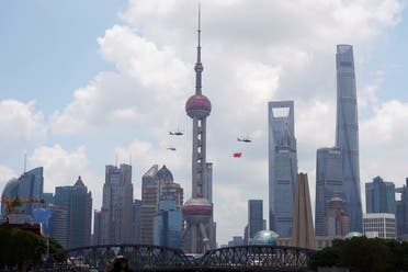 Aircraft fly in formation past Oriental Pearl Tower at Lujiazui financial district of Pudong on the 100th founding anniversary of the Communist Party of China, in Shanghai, China July 1, 2021. (Reuters)
