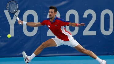 Novak Djokovic of Serbia reaches for a forehand against Alejandro Davidovich Fokina of Spain (not pictured) in a mens' singles round of sixteen match during the Tokyo 2020 Olympic Summer Games at Ariake Tennis Park Tokyo, Japan, on July 28, 2021. (Reuters)