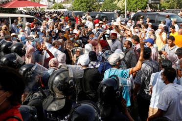 Supporters of Tunisia's Islamist Ennahda party gather outside the parliament building in Tunis, Tunsia July 26, 2021. (Reuters)