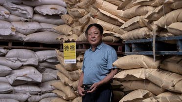 This file photo taken on September 24, 2019, shows Chinese farmer and billionaire Sun Dawu posing at a feed warehouse in Hebei, outside Beijing. (AFP)