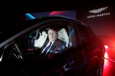 CEO of Aston Martin Andy Palmer poses for a photo inside the company's first sport utility vehicle Aston Martin DBX in Beijing, China November 20, 2019. (Reuters)