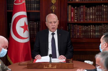 Tunisia's President Kais Saied, center, leads a security meeting with members of the army and police forces in Tunis, Tunisia, Sunday, July 25, 2021. (AP)