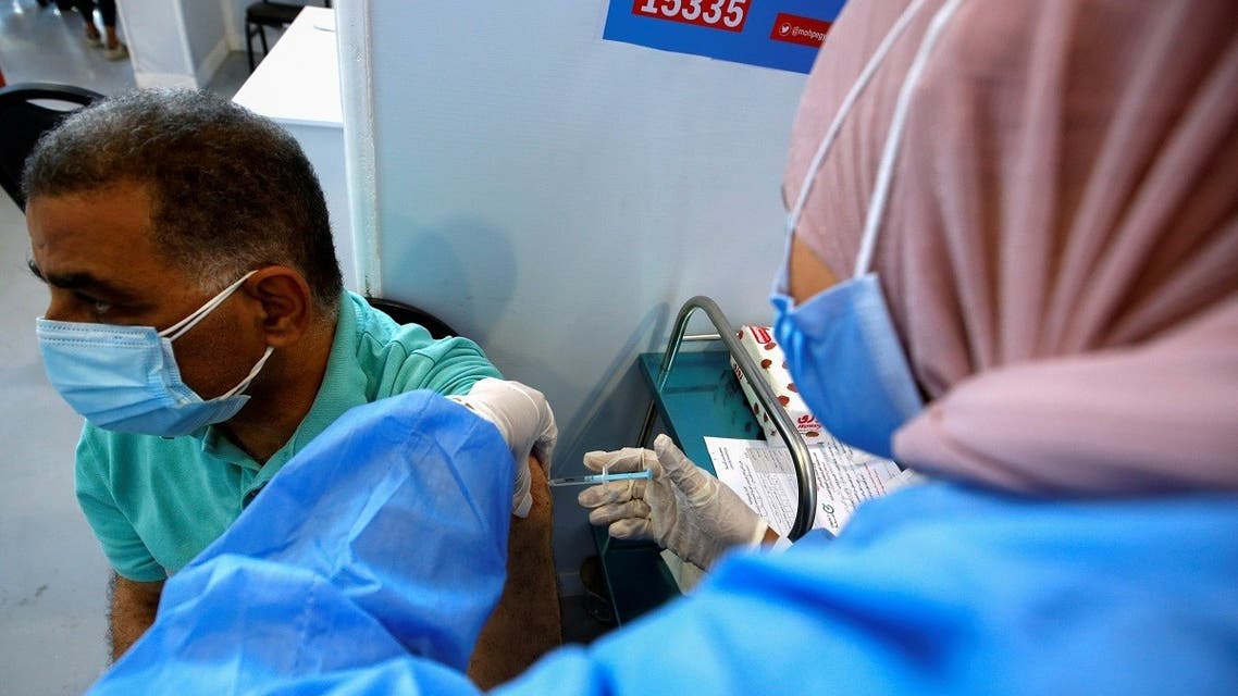 A man receives a dose of the China's Sinopharm vaccine against the coronavirus disease (COVID-19) at a mass immunization venue inside Cairo's International Exhibition Center in Cairo, Egypt. (Reuters)