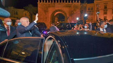 A handout picture provided by the Tunisian Presidency Facebook Page on July 26, 2021 shows Tunisian President Kais Saied gesturing as he enters a vehicle in Tunis's central Habib Bourguiba Avenue, after he ousted the prime minister and ordered parliament closed for 30 days. Tunisia was plunged deeper into crisis as Saied suspended parliament and dismissed Prime Minister Hichem Mechichi late July 25, prompting the country's biggest political party to decry a coup d'etat
