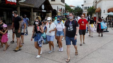 Disney Springs shoppers wear face masks and at Walt Disney World in Florida, July 11, 2020. (Reuters)