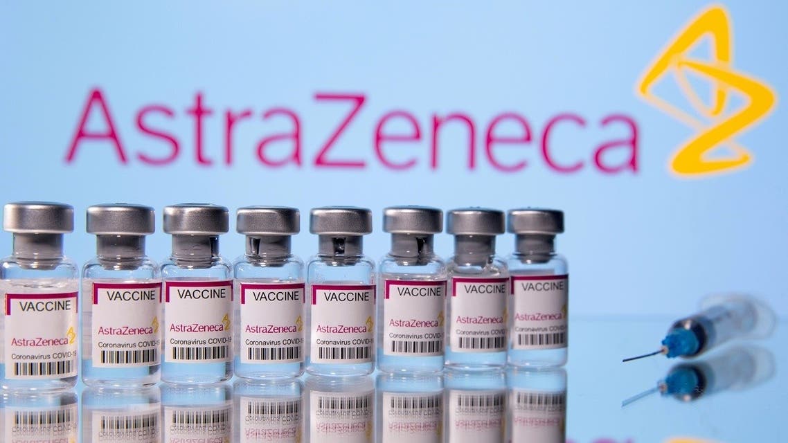 Vials labelled “Astra Zeneca COVID-19 Coronavirus Vaccine” and a syringe are seen in front of a displayed AstraZeneca logo, in this illustration photo. (Reuters)