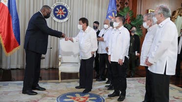 US Secretary of Defense Lloyd Austin fist bumps with Philippine President Rodrigo Duterte during a courtesy call at the Malacanang Palace in Manila, Philippines, on July 29, 2021. (Reuters)