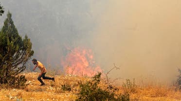 Wildfires spread in the forests of the Qubayyat area in northern Lebanon's remote Akkar region on July 29, 2021. A Lebanese teenager was killed as he joined volunteers battling devastating forest wildfires in northern Lebanon, where firefighters were struggling to protect homes from the blaze.